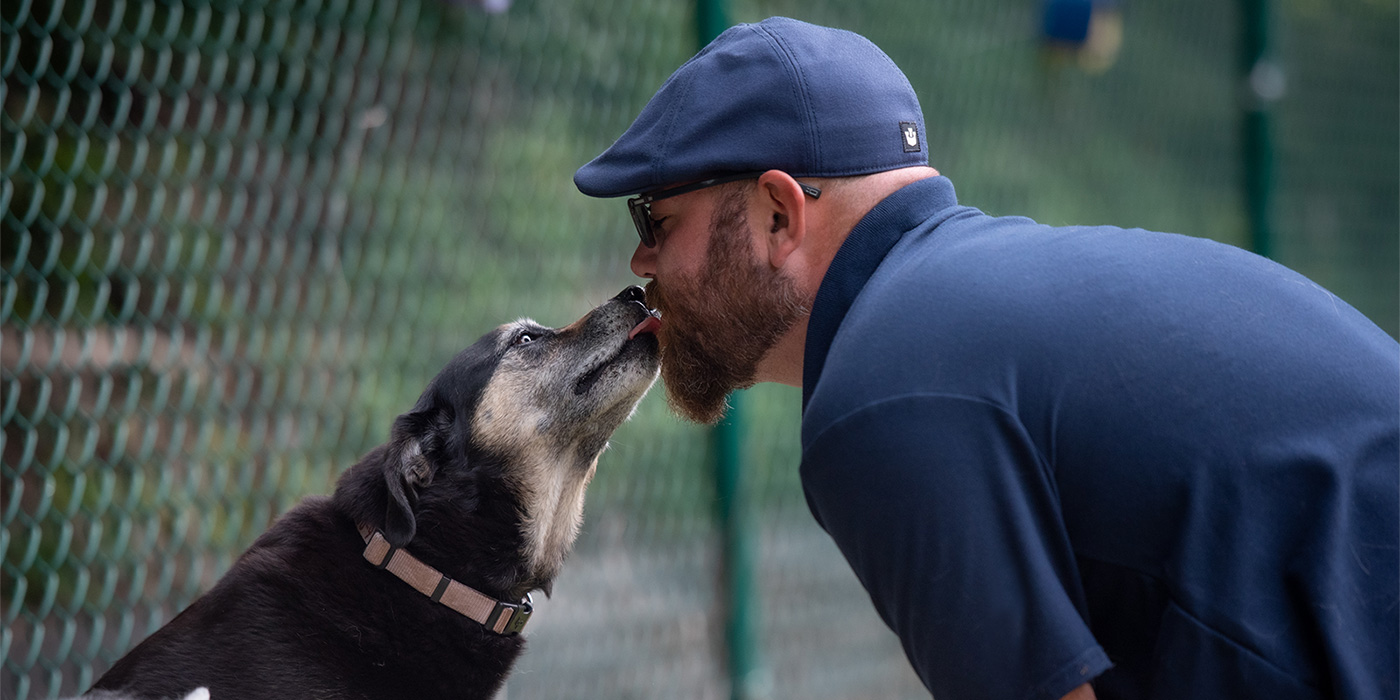 Dog licking Aaron's face