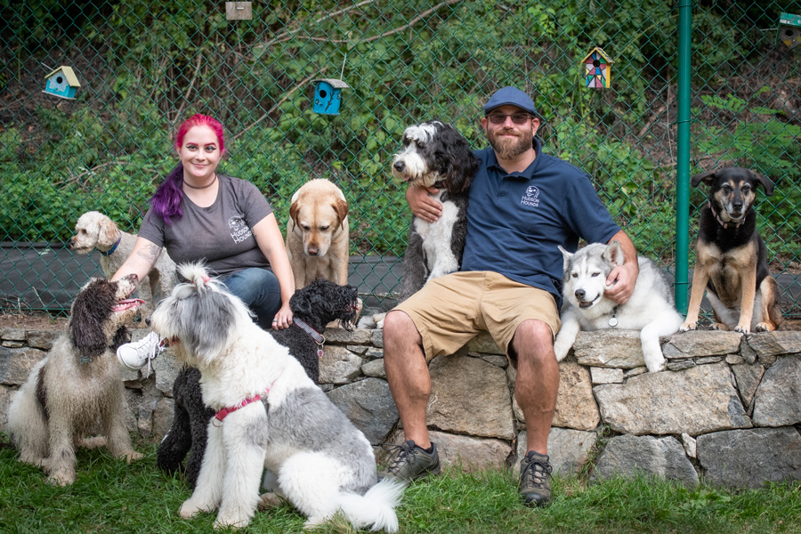 Aaron and Noelle in a group photo with the dogs